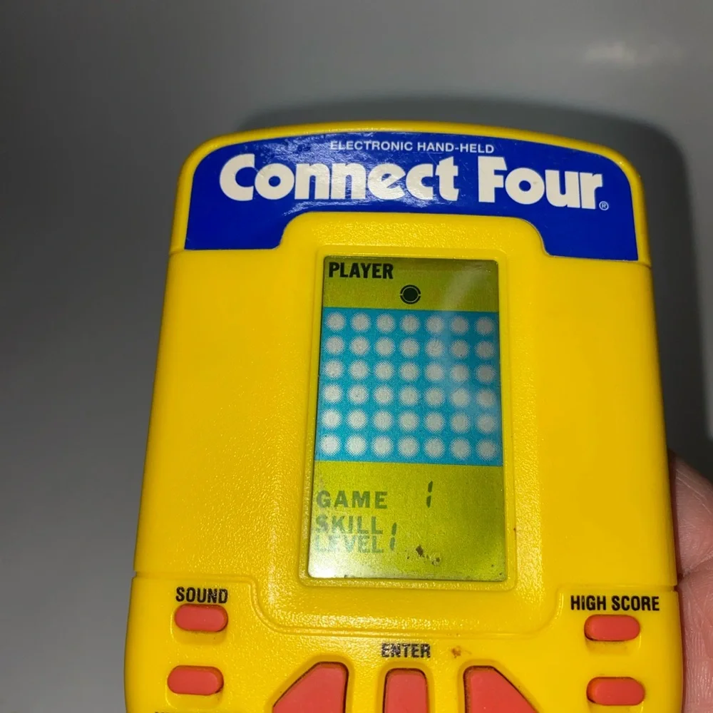 * Connect Four Electronic Handheld Game by Milton Bradley 1995